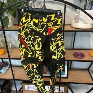 Bold Yellow and Black Graphic Pants one industry. Motocross youth outfit